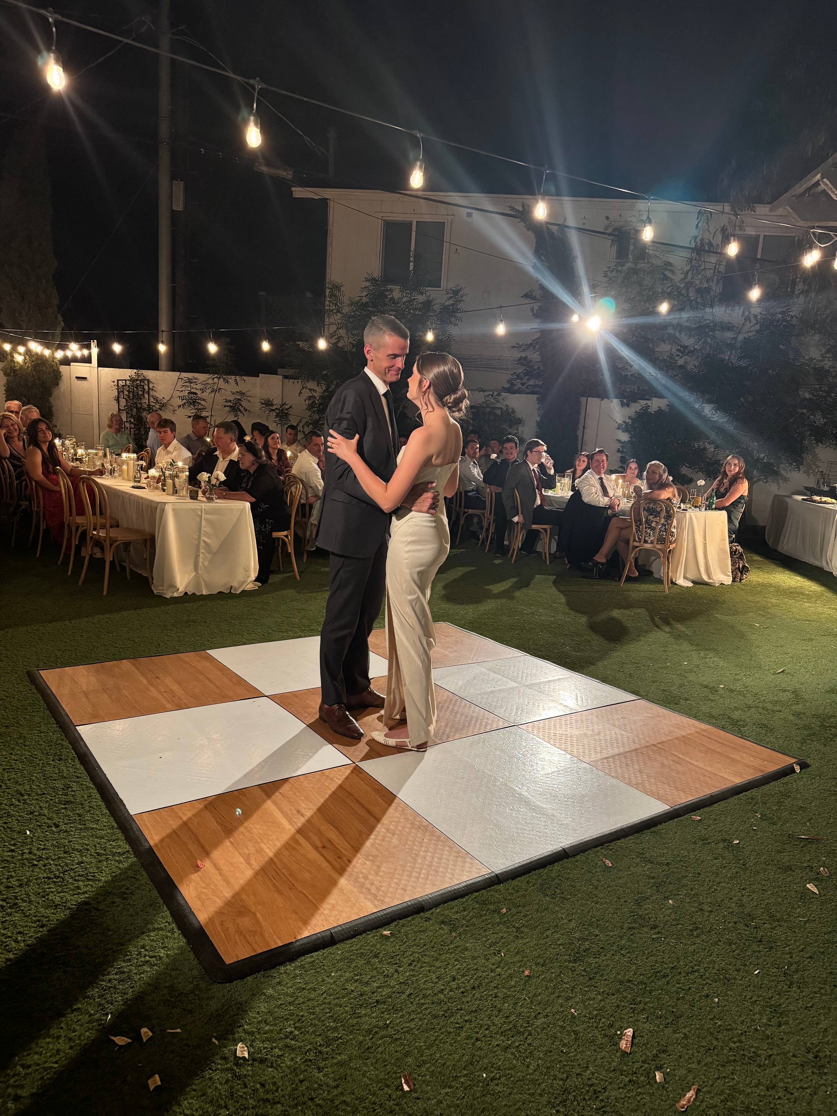 Couple dancing at outdoor wedding reception