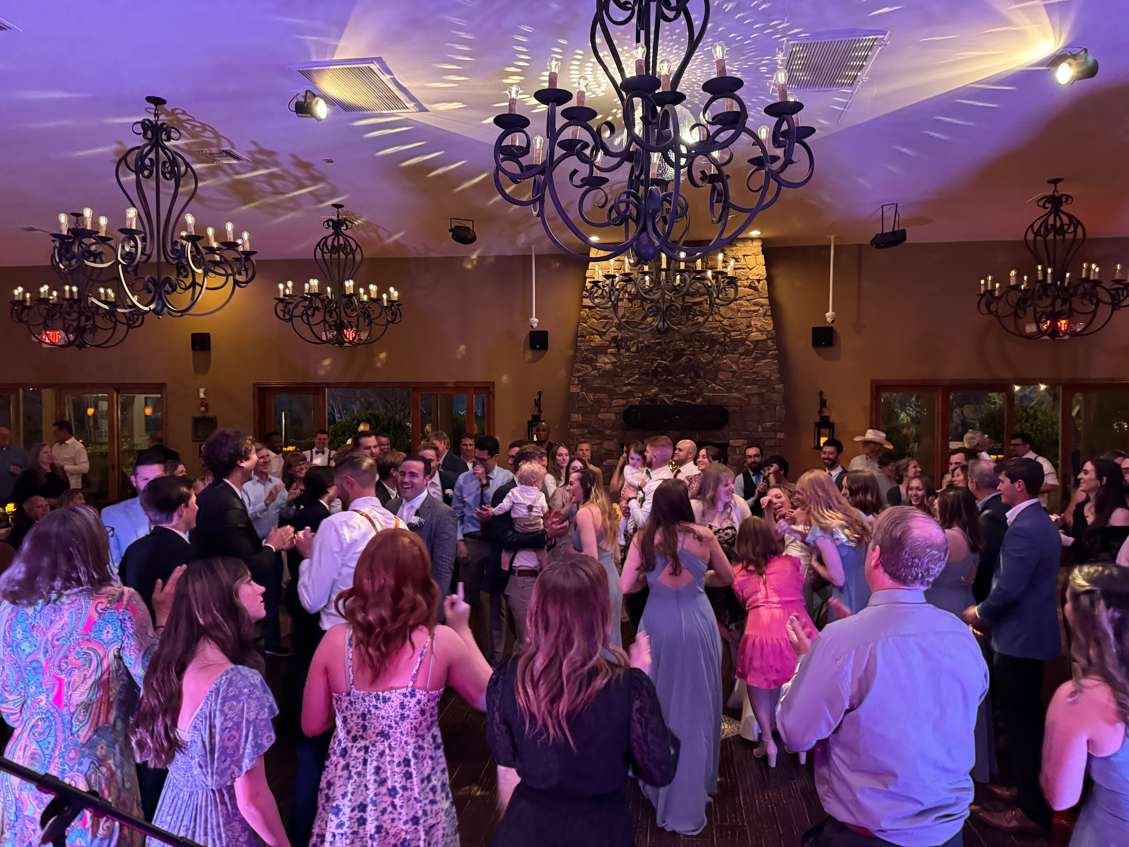 Elegant event venue with dancing crowd